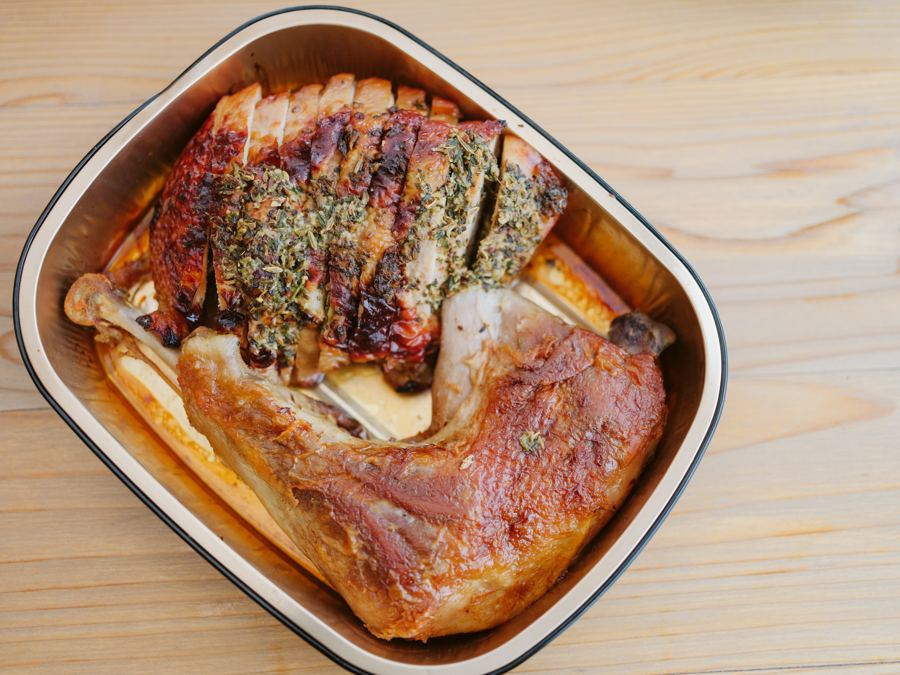 Half turkey, carved, in a gold catering tray